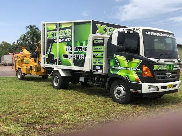 Xtreme Garden Care tree lopping and mulch sales truck with chipper on a rural block